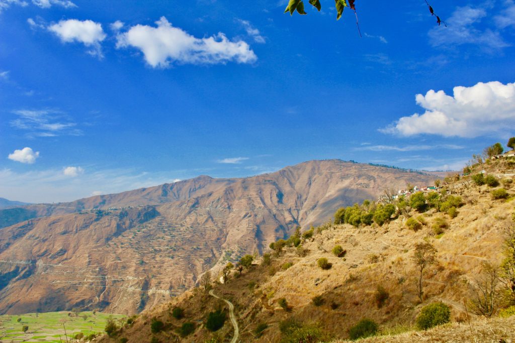 A beautiful view of mountains and sky along the way to Nag Tibba Trek