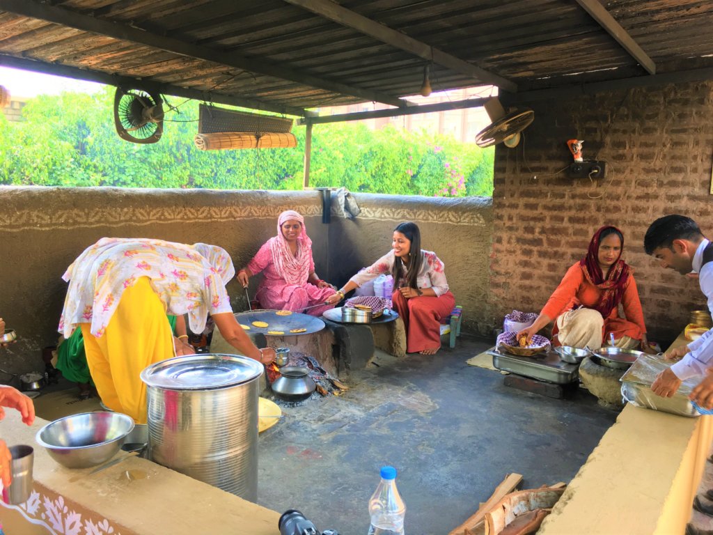 MJ baking rotis at Sadda Pind along with locals.